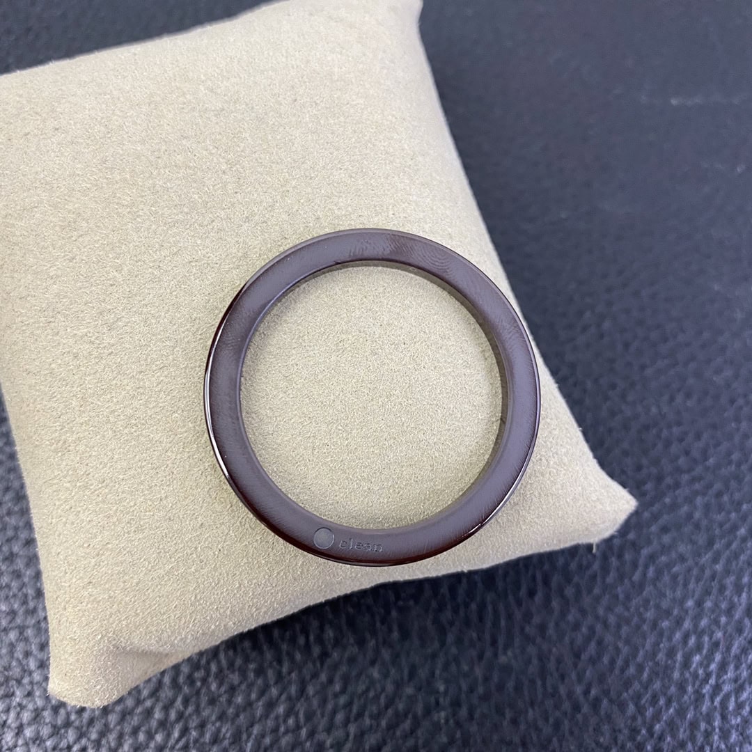 Reverse Side of Clean Factory Brown Ceramic Bezel with Clean Hallmark